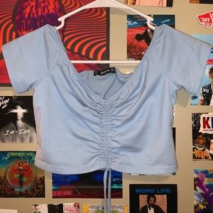 off the shoulder blue shirt